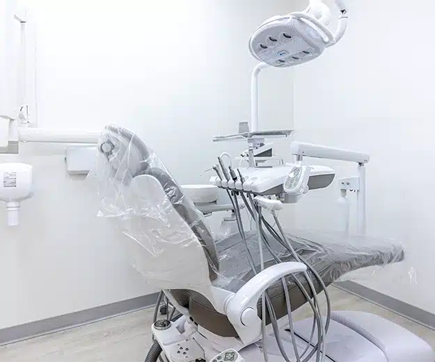 modern dental exam room with chair and equipment